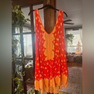 Free people intimately, never worn.  Coverup, slip.  Size medium.